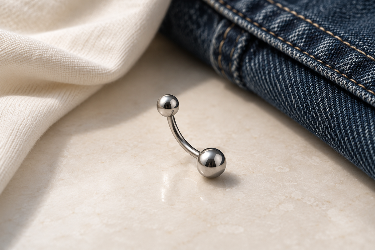 AI illustration of a curved barbell beside denim and cream fabric