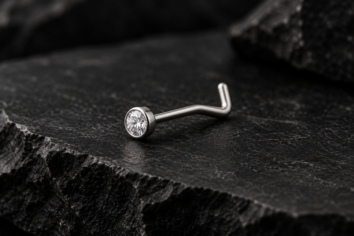 AI illustration of a clear-stone nose stud on black slate