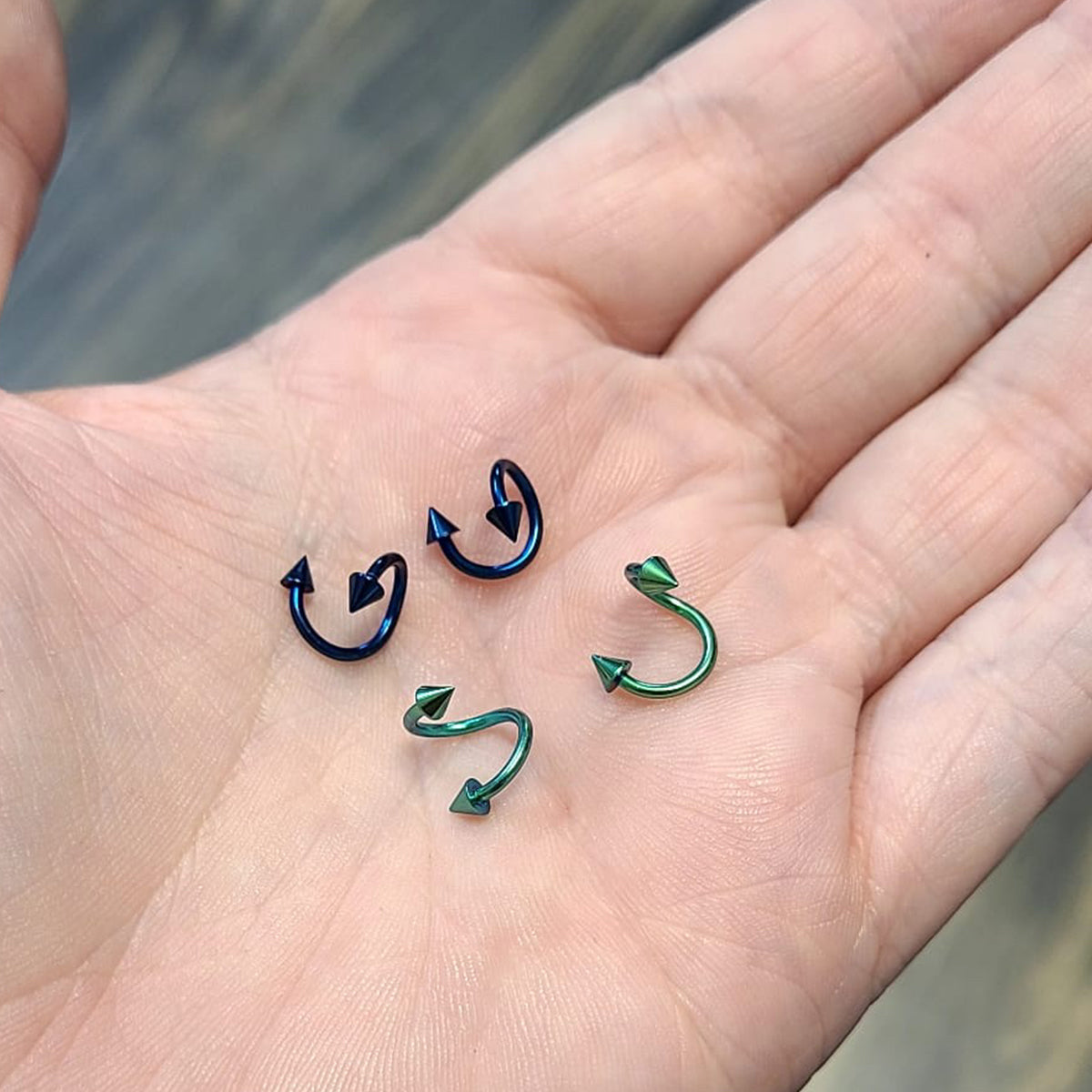 Anodized Titanium 16 Gauge Blue & Green Spike Twister Rings - 4 Pack