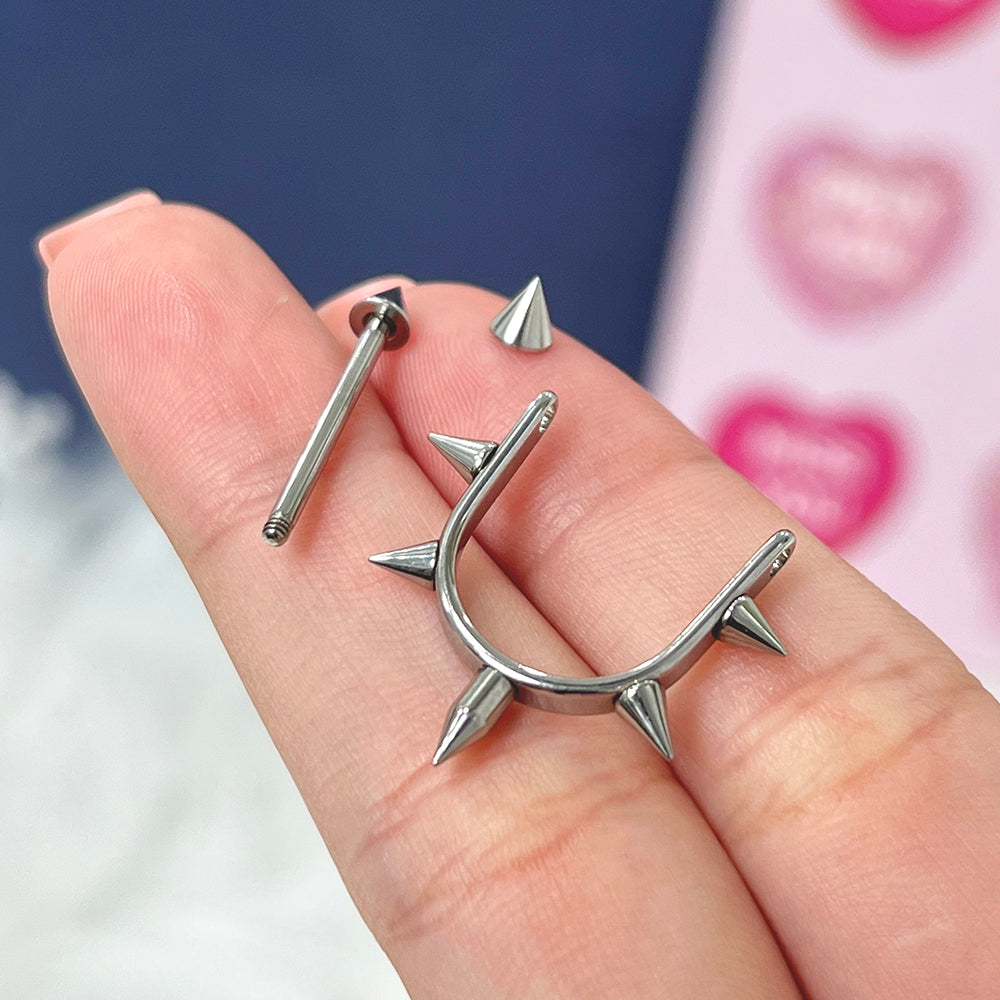 Titanium nipple stirrup barbells with spike ends