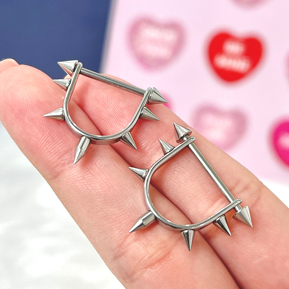 Titanium nipple stirrup barbells with spike ends