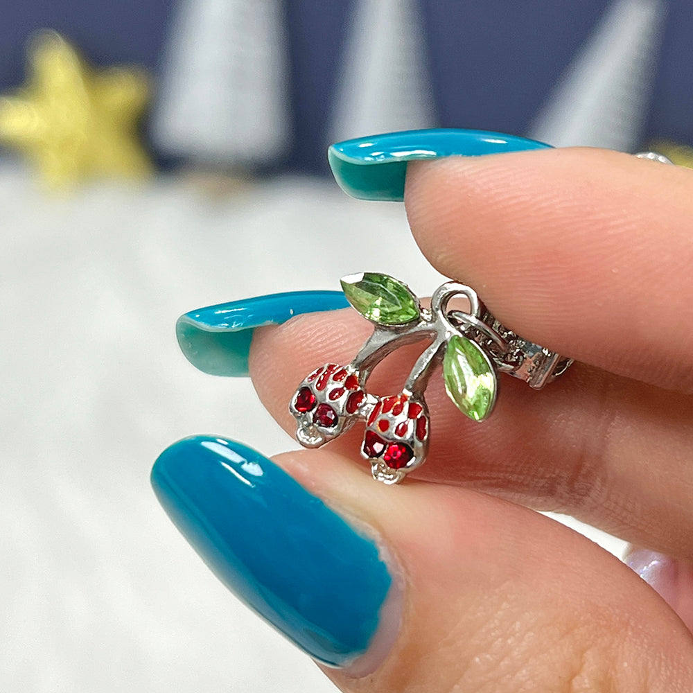 Surgical steel skull cherry dangle belly ring with red CZ